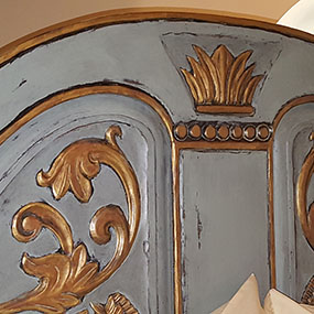 Headboard detail, painted to compliment bedding. Home has a French motif design.  Paradise Valley, AZ